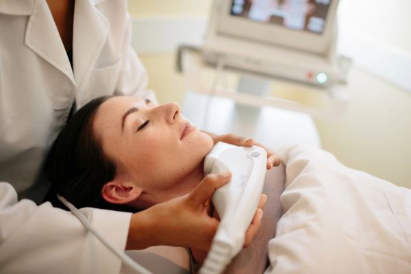 Doctor treating patient with ultherapy