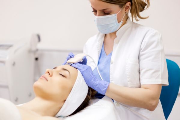 professional doctor carrying out a skincare treatment